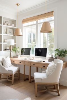 a home office with two computer screens on the desk and chairs in front of it