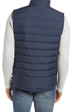 The layering possibilities are endless with this versatile down vest that offers tons of warmth and powerful protection against the elements. 26 1/2" length (size Medium) Lined, with down fill 100% polyester Machine wash, tumble dry Imported Outdoor Puffer Vest Jacket Sleeveless, Sleeveless Down Puffer Vest, Quilted Down Sleeveless Outerwear, Nylon Sleeveless Vest For Layering, Outdoor Puffer Vest With Down Filling, Outdoor Puffer Vest Made Of Down, Outdoor Down Puffer Vest, Sleeveless Down Puffer Jacket For Cold Weather, Sporty Nylon Vest For Cold Weather