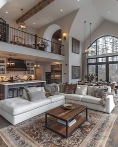 a living room filled with furniture and a large window