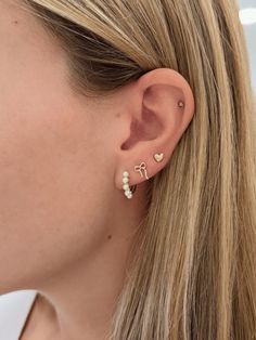 Embrace sweet simplicity with our Mini Puffy Heart Stud Earrings, crafted from 14k gold. These dainty studs feature a charming puffy heart design, perfect for adding a touch of love and elegance to your everyday style. Lightweight and versatile, they’re ideal for layering with other earrings or wearing solo for a subtle, chic statement that complements any look. Elegant Hypoallergenic Huggie Heart Earrings, Elegant Everyday Huggie Heart Earrings, Elegant Everyday Heart Huggie Earrings, Elegant Hypoallergenic Heart Earrings For Everyday, Elegant Hypoallergenic Everyday Heart Earrings, Elegant Everyday Hypoallergenic Heart Earrings, Elegant 14k Gold-filled Heart Earrings, Elegant White 14k Gold Heart Earrings, Dainty 14k White Gold Heart Earrings