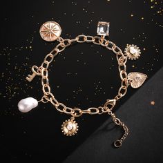 This Pearl Moon Star Bracelet adds a touch of elegance to your outfit. Its eight-pointed star symbolizes power and protection, while pearls create a delicate focal point. Wearing this exquisite piece is sure to give you the feeling of luxury, exclusivity, and timeless beauty. DETAILS Plating: 18K Gold Materials: 18K Gold on Brass, Imitation Pearl, Zircon Measurements: Length:  6.69 " (17.0cm)  + Extender: 1.97" (5.0cm) Weight:  15 g Gold Bracelet Jewelry With Star Charm, Gold Bracelet With Star Charm, Pearl Charm Bracelet In Metal, Gold Metal Bracelet With Star Charm, Gold Metal Bracelets With Star Charm, Pearl Charm Metal Bracelet, Gold Metal Crystal Bracelet As Gift, Gold Metal Crystal Bracelet For Gift, Spiritual Bangle Charm Bracelet