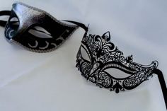 This is a gorgeous combination for his and hers masquerade masks. One is Silver and black which we put a dash of black glitter and silver around the eyes also sealed it with a beautiful silver trim! Part of the pair is beautiful laser cut metal mask with beautiful crystals and a black ribbon.I will combine a his and hers mask from any of my masquerade masks that fit both! I can combine my machine embroidered masks too that I make and change any color of my machine embroidered masquerade masks.Pl Black Masquerade Mask For Halloween Wedding, Black Masquerade Mask For Wedding Carnival, Black Venetian Masquerade Mask For Party, Elegant Silver Masks For Halloween, Black Formal Eye Mask Masquerade, Elegant Black Masks And Prosthetics For Party, Elegant Black Party Masks And Prosthetics, Elegant Black Mask For Costume Party, Black Venetian Masks For Party