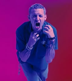 a man with his mouth open in front of a purple background