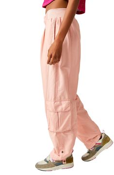 A slouchy fit and lightweight design mean these sporty pants with a plethora of pockets and a high waist are perfect for going from the studio to the street. 29" inseam; 18" leg opening; 12" front rise; 16 1/2" back rise (size Medium) Zip fly with hook-and-bar closure Partial ribbed elastic waist Side-seam pockets; back welt pocket; cargo bellows flap-patch pockets Roll-up cuffs with snap 70% cotton, 30% nylon Machine wash, line dry By Free People; imported Baggy Spring Joggers With Elastic Waistband, Pink Casual Parachute Pants With Multiple Pockets, Spring Baggy Joggers With Elastic Waistband, Relaxed Fit Ankle-length Cargo Parachute Pants, Relaxed Fit Cargo Parachute Pants Ankle-length, Relaxed Fit Cargo Style Parachute Pants, Spring High-waisted Harem Pants With Cargo Pockets, Elevated Casual Bottoms With Cargo Pockets, Relaxed Fit Parachute Pants With Pockets For Loungewear