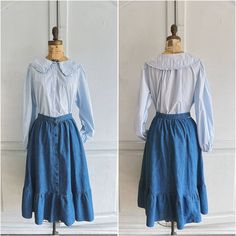 "70s Landlubber denim skirt with ruffled hem & pockets. Fits like xsmall. Shown on a size 2 dress form. Waist 12 1/2\" Length @29\"" Cotton Medium Wash Ruffled Skirt, Medium Wash Cotton Skirt With Ruffles, Denim Blue Ruffled Cotton Skirt, Denim Blue Cotton Skirt With Ruffles, Vintage Denim Skirt For Fall, Retro Denim Skirt For Fall, Vintage Skirt With Ruffle Hem For Spring, Fitted Vintage Denim Blue Skirt, Retro Cotton Skirt With Ruffles