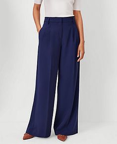 Elevate your wardrobe with the sophisticated charm of Ann Taylor's Pleated Wide Leg Pants in Pure Sapphire. These pants are a blend of style and comfort, tailored to enhance your silhouette with a high-rise waist and a relaxed, easy fit through the thigh. Perfect for both office and evening wear, these pants promise versatility and elegance.

- Size: 2 Regular
- Color: Pure Sapphire
- Material: 73% Polyester, 20% Rayon, 7% Spandex
- Gender: Female
- Fit: Relaxed and easy
- Rise: High rise, sits Flattering Pants, Knitted Suit, Sapphire Color, Evening Wear, Effortless Style, Leg Pants, Ann Taylor, Wide Leg Pants, Gender Female