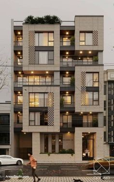 an apartment building with lots of windows and balconies