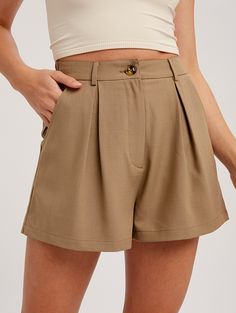 Woven bottom shorts with button and zipper closure - Pleat detail on front - Elastic band on center back with belt loop - Side pockets on the back - Finished with clean hem - Model is 5' 10" 33-24-35 and wearing a size Small Fabric: 96% polyester & 4% spandex **THIS ITEM IS A FINAL SALE ITEM. NO RETURNS OR EXCHANGES ALLOWED** Trendy Short Skort With Belt Loops, Solid Color Shorts With Short Inseam And Pockets, Solid Shorts With Pockets And Short Inseam, Shorts With Pockets And Short Inseam, High-waisted Shorts With Pockets, Solid Color High-waisted Shorts With Pockets, Solid High-waisted Shorts With Pockets, Casual High-waisted Shorts With Belt Loops, Solid Color Shorts With Belt Loops For Summer