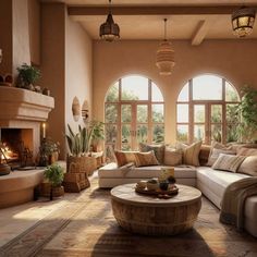 a living room filled with lots of furniture next to a fire place and large windows