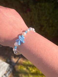 This is a super cute summer ☀️and beachy 🌊blue pearl bracelet also  made with 1 starfish bead,  -choose your bracelet size by sliding to the picture that says "bracelet sizes" and measure your hand and choose your dimensions.  -affordable  -comfortable  -handmade -your supporting a small business  -this business is made with lots of 💛. -instagram is @moonlightshopstudio, tag me with your order and it will be posted on my story! -gmail : moonlightshop78@gmail.com -this jewelry is not perfect as