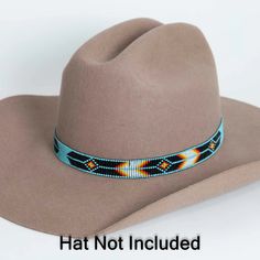 The Arapaho Turquoise Beaded Hat Band is a stylish and unique accessory that can give your hat a fresh new look. The band is made up of small, colorful beads that have been expertly strung together to create a beautiful pattern. The turquoise beads in particular add a touch of elegance and sophistication to any hat.**Please note this is the hatband only** Turquoise Brimmed Hat For Festivals, Turquoise Brimmed Hats For Festival, Blue Festival Hat Bands One Size, Blue Festival Hat Band One Size Fits Most, Blue Hat Bands For Festival, One Size Fits Most, Blue Festival Hat Bands One Size Fits Most, Blue Festival Hat Band, One Size Fits Most, Multicolor Bohemian Hat With Bead Caps, Bohemian Blue Beaded Hat