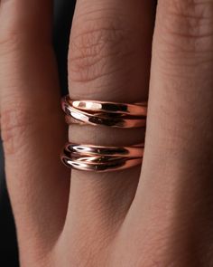 This is a gorgeous, unique ring set made up of three individual, entwined rings. These are a favorite for both men and women. Customize the finish, metal type and more to create your own perfect ring! This listing is for one single Interlocking ring set made up of 3 INDIVIDUAL RINGS which are permanently entwined. Each band measures approx. 2mm in width and is made from a D-Shaped, half round metal. This Interlocking ring set includes three 14K ROSE GOLD FILL rings. These Interlocking rings can Interlocking Rings, Interlock Rings Wedding Bands, Adjustable Hand Forged Gold Stackable Rings, Interlocking Ring Set, Modern Rings In Recycled Gold, Tarnish Resistant, Rolling Ring, Interlocking Ring, Three Rings, Bold Rings