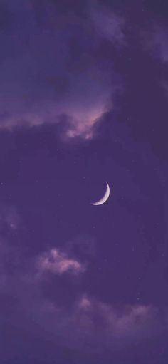 the moon is in the purple sky with clouds