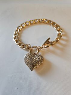 Very nice heart bracelet with toggle. See photos for measurements. Heart Charm Bracelet With Toggle Clasp For Gift, Heart Shaped Bracelet With Toggle Clasp As Gift, Heart-shaped Charm Bracelet With Lobster Clasp, Heart-shaped Charm Bracelet With Toggle Clasp As Gift, Metal Heart Bracelet With Toggle Clasp As Gift, Heart Shaped Toggle Clasp Bracelet For Gift, Metal Heart Bracelet With Toggle Clasp, Toggle Bracelet, Heart Bracelet