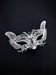 Crafted with intricate detail, this women's white masquerade mask embodies the grace and allure of the fox, making you a captivating presence at any masquerade event. Rhinestones adorn the mask, reflecting the light and adding a touch of elegance to your appearance. From grand masquerade balls to themed celebrations and elegant gatherings, our mask is the perfect addition to any look!


Age Group/Gender - Adult/Women's

Size/Type - One size fits all adults

Mask Color - White

Mask Material - Me White Eye Mask For Masquerade, Elegant White Masquerade Mask For Carnival, White Masquerade Mask For Mardi Gras Gift, White Masquerade Mask For Mardi Gras, White Fantasy Eye Mask, Elegant White Masquerade Mask For Mardi Gras, Elegant White Masquerade Mask, Elegant White Eye Mask, White Eye Mask Masquerade Mask As Gift