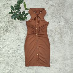 Solid Color Slim Fit Pleated Lapel Sleeveless Bag Hip Dress Brown Sleeveless Dress With Buttons, Chic Sleeveless Midi Dress With Button Closure, Summer Workwear Mini Dress With Halter Neck, Summer Halter Neck Mini Dress For Work, Sleeveless Midi Dress With Button Closure For Date Night, Sleeveless Brown Mini Dress For Day Out, Brown Sleeveless Mini Dress For Day Out, Elegant Collared Sleeveless Dress For Summer, Brown Sleeveless Dress With Button Closure