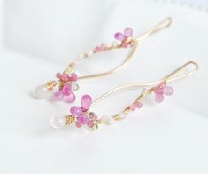 "Inspired by cherry blossom, Pink sapphire and Rose quartz earrings. Delicate yet unique, can be worn with pair of jeans or fancy dress. The earrings is represents beauty of cherry blossom, also strong presence. 14k gold filled, 20gauge ( 0.8mm thick) Pink sapphire, Peridot, Rainbow moonstone, Peridot, Pink tourmaline Total length of the earrings is approx 2\" (5.2cm) Come in a gift box Made to Order Chandelier version is here, https://www.etsy.com/listing/181287721/cherry-blossoms-earrings-pink Elegant Pink Jewelry Hand Wrapped, Elegant Pink Hand Wrapped Jewelry, Elegant Hand Wrapped Pink Jewelry, Cherry Blossom Jewelry, Earrings Japanese, Wedding Earrings Chandelier, Pink Sapphire Earrings, Japanese Jewelry, Wedding Image