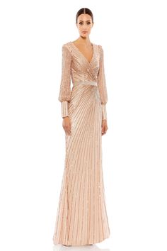 This stunning evening dress is perfect for any special occasion, such as a mother of the bride. The dress features a fitted column silhouette with a plunging neckline and long puff sleeves. It is made from a sparkling sequin material and embellished with delicate beadwork, creating a truly luxurious look. The dress is further enhanced with a long train and the convenience of a convenient zip-up back. Make a lasting impression and embrace your glamorous side in this beautiful long gown. Peach Gown, Puff Sleeve Gown, Sheath Gown, Formal Dresses With Sleeves, Sleeve Gown, Long Sleeve Gown, Sequin Gown, Mac Duggal, Sequin Fabric