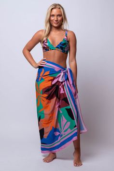 Unleash your inner beach goddess with our Ananya SARONG. Versatile and beachy, this sarong is perfect for all your summer adventures. Go from beach to bar in style with this must-have accessory. Fit Guide: One Size *available at our bandit location Tropical Tie-side Sarong For Vacation, Tropical Vacation Sarong With Tie-side, Tropical Tie-side Sarong For Pool, Bohemian Sarong With Tropical Print For Pool, Bohemian Tropical Print Sarong For Pool, Multicolor Sarong For Beach Season And Pool, Multicolor Sarong For Pool And Vacation, Multicolor Sarong For Pool And Beach Season, Summer Green Sarong For The Beach