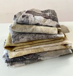 four folded cloths sitting on top of each other