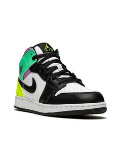 a pair of black, white and green sneakers