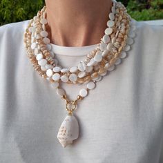 Cheap White Mother Of Pearl Necklaces, Handmade Long White Necklace, Elegant White Shell Necklace With Natural Stones, White Multi-strand Jewelry With Natural Stones, Elegant Mother Of Pearl Necklace For Beach, Elegant Mother Of Pearl Beach Necklace, Elegant Shell Necklace With Natural Stones, Elegant Shell Jewelry With Natural Stones, Bohemian Pearl White Necklaces With Round Beads