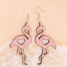 Flamingo Design Earrings for the Ocean Lover. Laser cut from 1/8 inch MDF covered with patternply. Hardware is stainless steel. Front is Pink and back is red. Earrings are extremely light - the pair weighs approximately 3 grams. The flamingo is approximately 2 inches long and 1 inch wide. Available in 3 styles - plain, heart and flower.**Each item at Sprouting Expressions is handcrafted and pictures are a representation of the item that will be made for you, variations occur due to wood grain an Glowforge Projects, Flamingo Design, Flamingo Earrings, Laser Projects, Laser Cut Jewelry, Laser Cut Earrings, Earring Ideas, Ocean Lover, Design Earrings