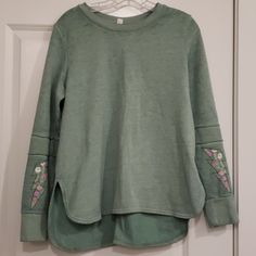 Soft Green Sweatshirt With Embroidered Sleeves. Never Worn. Like New. Size Small Relaxed Fit Embroidered Tops For Loungewear, Casual Embroidered Long Sleeve Tops, Green Embroidered Long Sleeve Tops, Casual Crew Neck Top With Embroidered Hem, Green Floral Embroidered Tops For Fall, Green Floral Embroidery Tops For Fall, Spring Crew Neck Top With Embroidered Hem, Casual Green Sweater With Embroidered Graphics, Cotton Crew Neck Top With Embroidered Hem