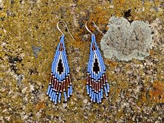 Statement earrings for powerful womxn. Send your climbs, summit your peaks, and take up your unique space in the outdoors. These stunning, hand stitched beaded earrings in a Southwestern theme will empower you on your next adventure. These sophisticated dangle earrings will empower you to feel beautiful wherever you go. The color scheme is inspired by the colors of the desert at twilight. Ear wires are gold-plated, silver, or copper. Please specify the type of metal you would like when ordering. Blue Southwestern Beaded Fringe Earrings, Southwestern Blue Beaded Fringe Earrings, Southwestern Handwoven Blue Jewelry, Artisan Blue Earrings With Beaded Fringe, Southwest Chic, Beaded Fringe Earrings, Seed Bead Patterns, Beading Techniques, Beaded Fringe