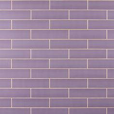 a purple brick wall with gold foil on it