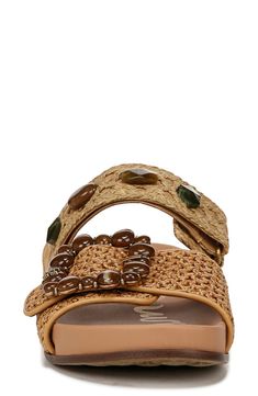 Bring the beauty of paradise wherever you go in this woven-strap sandal embellished by earthy elements and a chunky buckle. 1" heel; 1/2" platform (size 8.5) Textile upper/synthetic lining and sole Imported Brown Braided Sandals With Round Toe, Brown Braided Round Toe Sandals, Brown Braided Sandals For Vacation, Bohemian Sandals With Buckle Closure And Adjustable Fit, Brown Braided Sandals For The Beach, Brown Woven Leather Wedge Sandals For Vacation, Beach Brown Footbed Sandals With Heel Strap, Brown Sandals With Heel Strap For Vacation, Earthy Elements