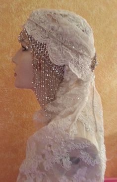 a mannequin wearing a white veil and headpiece