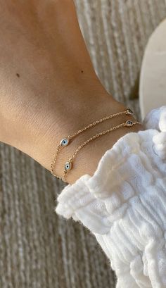 Greece Jewelry Aesthetic, Evil Eye Jewelry Aesthetic, Elegant Everyday Evil Eye Bracelet, Yellow Gold Evil Eye Jewelry, Minimalist 14k Gold Evil Eye Bracelet, Trendy Gold Evil Eye Bracelet, Adjustable Gold Evil Eye Bracelet For Everyday, Minimalist 14k Gold Evil Eye Bracelet Gift, Dainty 14k Gold Evil Eye Bracelets