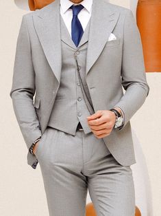 This grey 3-piece slim-fit suit is the epitome of sophistication and style. The jacket features wide lapels, creating a bold statement and showcasing a keen eye for detail. The vest, with its matching lapels, further elevates the aesthetic and provides a cohesive look. Upgrade your wardrobe with this standout piece and make a lasting impression at your next event. Color: grey Material: 60% wool, 30% polyester, 7 viscose, 3% elastane Suit includes blazer, waistcoat, & trousers Single-breasted sui Blazer Waistcoat, Grey Slim Fit Suit, Lapel Jacket, Slim Fit Suit, Grey Material, Slim Fit Shirt, Blazer Buttons, Single Breasted, Workout Shirts