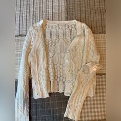 Altard State Cream Crochet Knit Cardigan Cropped Button Up Grandma Core Nwt Sweater Ivory Nwt Excellent Condition! No Signs Of Wear. Super Soft Cropped Lightweight Cardigan. Cottage/Grandma Core. 60% Cotton 40% Acrylic. Please See Pics For Approximate Measurements, Comes From A Smoke Free Pet Friendly Home. Send An Offer! :) Such A Steal White Knitted Button-up Outerwear, White Cable Knit Button-up Cardigan, White Knit Sweater With Buttons, White Knit Sweater With Button Closure, White Cable Knit Button-up Sweater, White Knit Button-up Sweater, White Button-up Cable Knit Cardigan, White Button-up Knit Sweater, White Button-up Cardigan For Layering