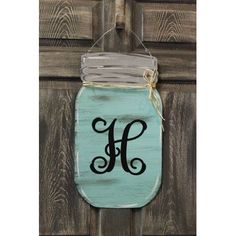 a mason jar door hanger with the letter h painted on it's side