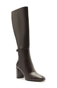 Designed to complement any style and occasion, this napa-leather boot is handcrafted with a tall block heel and decorative buckle strap. 2 3/4" (70mm) heel Side zip closure Leather upper, lining and sole Made in Brazil Designer Shoes Formal Boots With Block Heel, Luxury Knee-high Boots With Block Heel, Elegant Boots With Stacked Heel And High Shaft, Elegant High Shaft Boots With Stacked Heel, Formal Block Heel Boots, Formal Boots With Stacked Heel And High Shaft, Formal Heeled Boots With Buckle Closure And Block Heel, Formal High Shaft Boots With Stacked Heel, Formal Block Heel Boots With Buckle