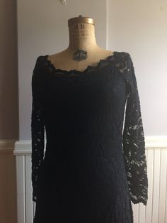 "Black Stretch lace dress that sits right on the shoulder with a beautifully designed neckline. Made in Canada, under the label Joseph Ribkoff. Tag inside indicates it's a size 12( Canada, USA, Mexico) size 40(Germany),Size 14(UK),size 42,(France). Fabric content, 71% nylon, 26% rayon, 3% spandex, 100% polyester lining. The great attribute of this dress is you can hand wash in cold water, dry flat! No dry cleaning, no unnecessary chemicals. Lines are very flattering and fitted to the body with a Fitted Off-shoulder Lace Dress For Formal Occasions, Formal Fitted Off-shoulder Lace Dress, Black Lace Top For Formal Occasions, Fitted Black Lace Dress For Wedding, Fitted Scalloped Lace For Evening, Black Scalloped Lace Top For Evening, Black Fitted Dress For Mother Of The Bride, Black Lace Back Dress For Wedding, Formal Fitted Lace With Lace Sleeves