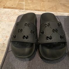 Black Gucci Slides. Work A Handful Of Times And Well Taken Care Of. Stored In My Closet Most Of The Time. No Blemishes Or Marks. Size 7. Have The Original Box With Dust Bag. Bought For $400 On The Gucci Website Brand New. Gucci Black Slip-on Sandals, Black Gucci Slip-on Sandals, Designer Black Closed Toe Sandals, Designer Black Sandals, Gucci Black Luxury Sandals, Black Gucci Luxury Sandals, Black Gucci Open Toe Sandals, Designer Black Slip-on Sandals, Black Designer Slip-on Sandals