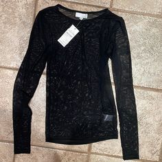 Long Sleeve Meesh Top Brand New Never Worn Black Fishnet Top For Fall, Fitted Black Mesh Top With Open Knit, Stretch Open Knit Mesh Top, Stretch Mesh Top With Open Knit, Fitted Black Open Knit Mesh Top, Black Mesh Top With Mesh Sleeves For Fall, Black Mesh Top With Mesh Sleeves For Winter, Sheer Mesh Top For Winter, Black Nylon Mesh Top With Long Sleeves