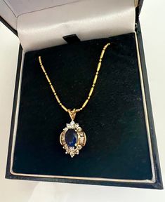 "Regal Sapphire & White Topaz 9k Gold Fill Pendant Necklace. Sapphire Gold White Topaz Necklace . Royal Sapphire Antique Style Necklace A truly lovely and elegant necklace. Pendant is not stamped but is of a low grade gold (approx 9k) 💙 Chain is gold filled, such a pretty combo! Pendant: 7/8 inch long Chain: 17 inches long Don't miss out. A divine gift for yourself or someone you love! *If you have have any questions regarding this item, please hit the \"Ask a Question\" button next to the pric Sapphire Pendant Necklace Vintage, Vintage Sapphire Necklace, Pretty Pendant Necklace, Gold And Sapphire Necklace, Sapphire Necklace Vintage, Royal Pendant, Sapphire Necklace Gold, Necklace Royal, White Topaz Necklace