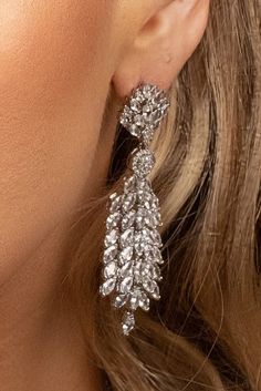 The SADIE statement earrings feature an exotic and unique look that can be worn for any occasion. The design gives it a 3D look to make the earrings refined and enduring. These will surely be the go to earrings in your high style collection and big event! Handcrafted Highest Quality Swarovski / Cubic Zirconia Platinum plated Guards against scratches and tarnish. approximate size 2.5" length 1" width Nickel free Free Shipping in USA Anna Wedding Dress, Crystals Earrings, Boutique Couture, Silver Statement Earrings, Gold Statement Earrings, Swarovski Crystal Earrings, Earrings Wedding, Wedding Jewelry Sets, Wedding Earrings