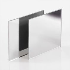 two metal frames sitting side by side on a white surface