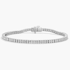 Simple and elegant, this classic tennis bracelet features emerald cut diamonds framed in 14k white gold. Pearl Bracelet Gold, Pearl Jewelry Gift, Platinum Chain, Platinum Rose Gold, Gold Rings Fashion, Diamond Tennis Bracelet, Emerald Cut Diamond, Gold Pearl Necklace, Ladies Diamond Rings