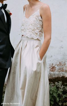 a bride and groom standing next to each other