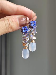 This is a pair of exquisitely blue chalcedony. I used light blue opal and tanzanite to creating a gradient effect, embellishing a lampwork flower. They also weigh very well and are suitable for daily wear. ●Chalcedony ●Opal ●Tanzanite ●Lampwork flowers ●14K gold filled ●total length approximately: 2 inches ●weight：4.1g Welcome to visit my Jewelry store: https://www.etsy.com/shop/Ukuly 🌸The delivery time to Most regions of North America, Australia and Europe is usually about 10-15 days. Buyers from Brazil, South Korea, and Indonesia, please provide me with your tax number through messages or notes for smooth shipment. Thank you. 🌸Please let me know your phone number when you place an order. It will be used for shipping label only. 🌸I will pack the goods very carefully and beautifully. Th Lampwork Flowers, Earrings Everyday, Shipping Label, Blue Chalcedony, 925 Silver Jewelry, Everyday Earrings, Earrings Dangle, Blue Opal, Jewelry Store