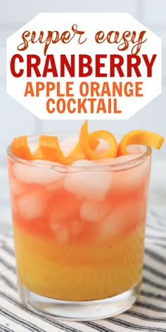 an orange and white drink in a glass with the words super easy cranberry apple orange cocktail