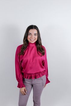 Magenta is in this season! Be bold in this bright long sleeve blouse with pleated cuffs, neckline and hem. Color: Magenta Fabrication: 97% Polyester, 3% Spandex Sizing: Model Measurements (5’3”, Bust 33”, Waist 30”, Hips 37”). Wearing a size small. Bell Sleeve Top, Spandex, Ruffle Blouse, Long Sleeve Blouse, Women's Top, Fabric, How To Wear, Color