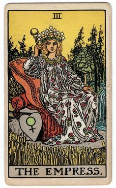 a tarot card with an image of a woman sitting in the grass