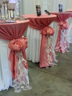 the tables are decorated with pink and white linens